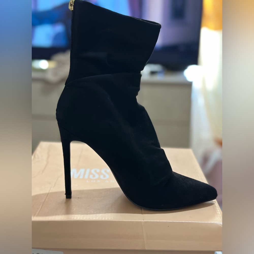 Selling black booties, size 8. Only worn once